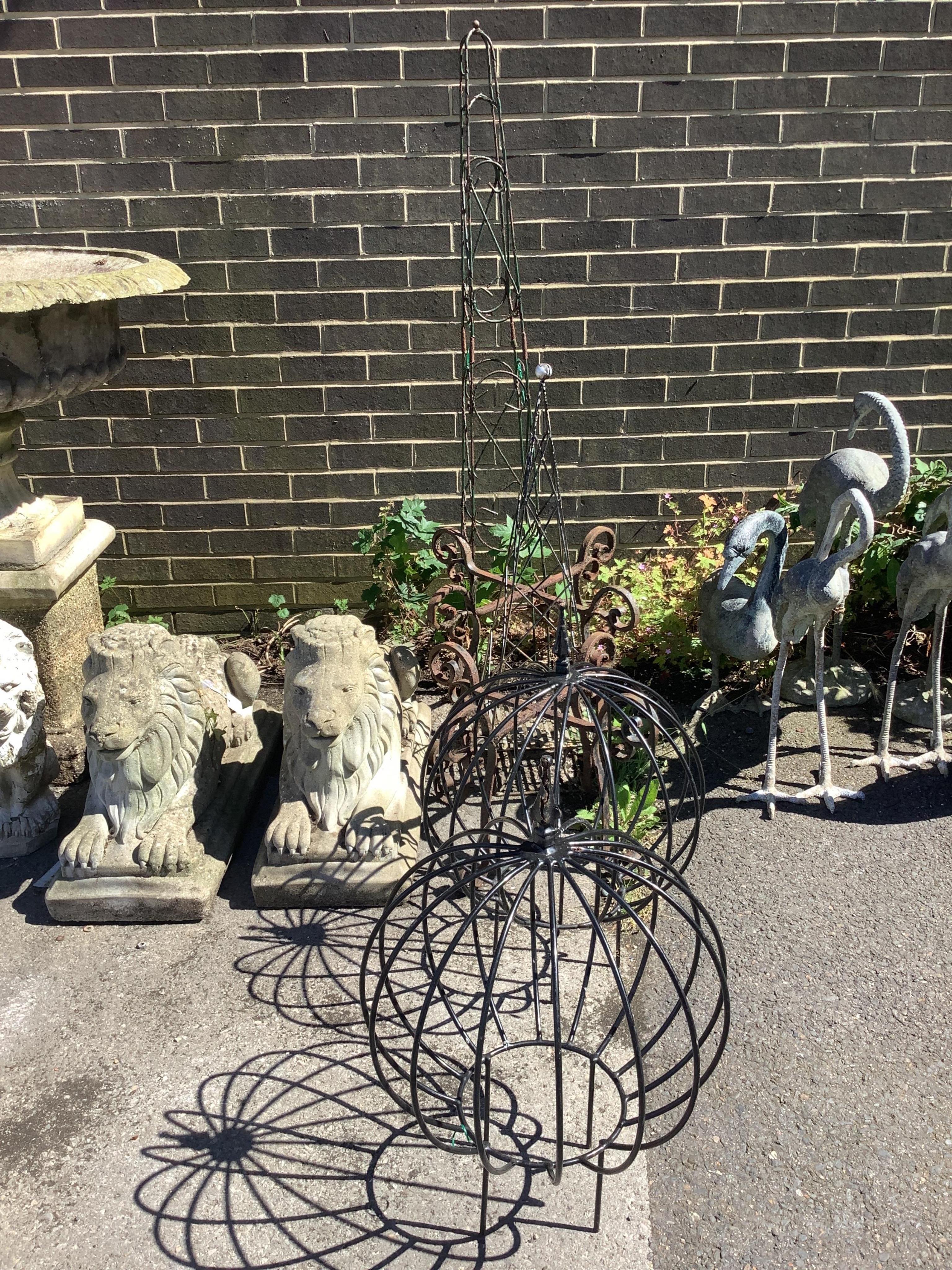 Three wirework garden growing frames, an obelisk and two iron stands, largest height 151cm. Condition - fair